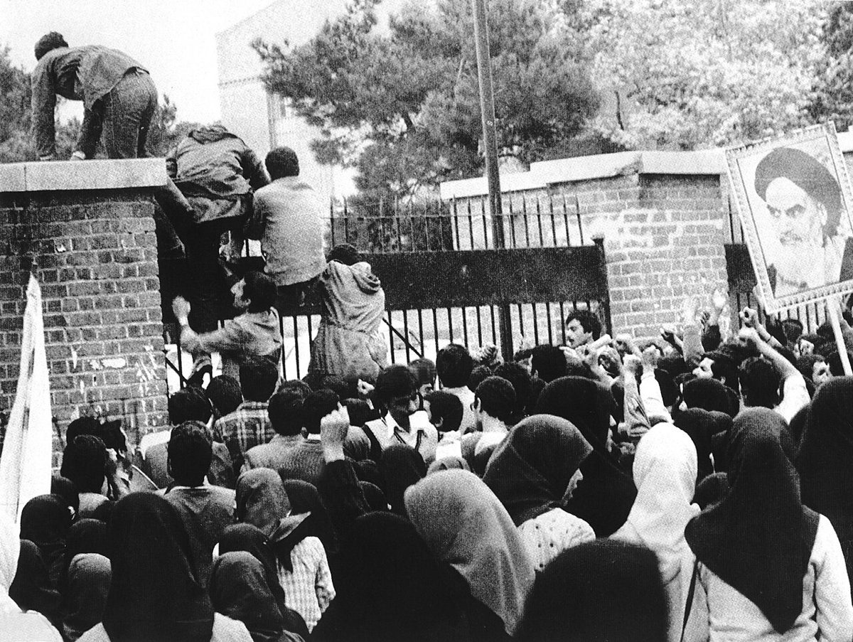 Iranian students climb the gates of the U.S. Embassy in Tehran, November 1979.