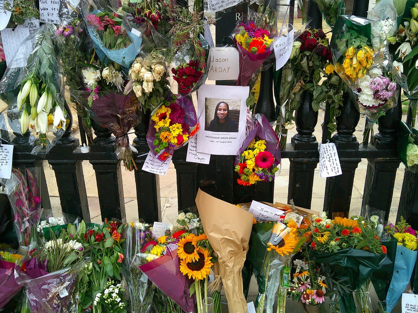 Floral tribute near Cambridge Senate House after Arday’s death, August 2026.
