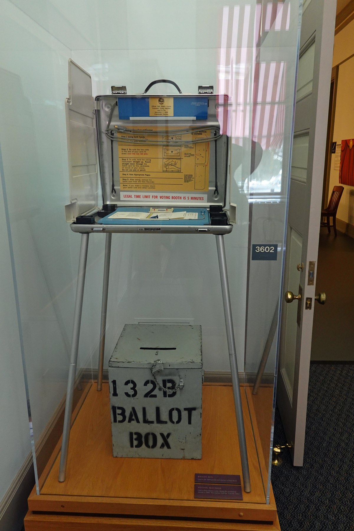 A Votomatic machine identified as used in Palm Beach County in 2000, exhibited at the Florida Historic Capitol Museum; photographed November 14, 2019.