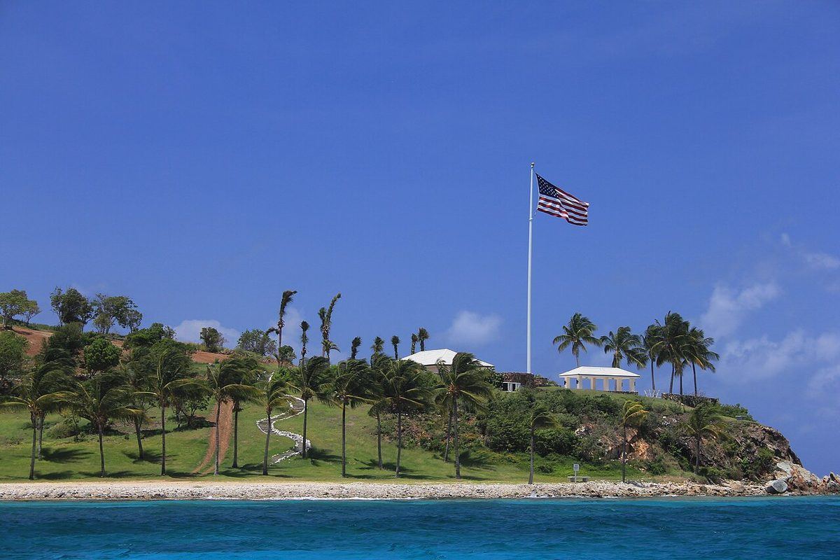 Little St. James from the sea, June 2013, with its buildings visible on the ridge.