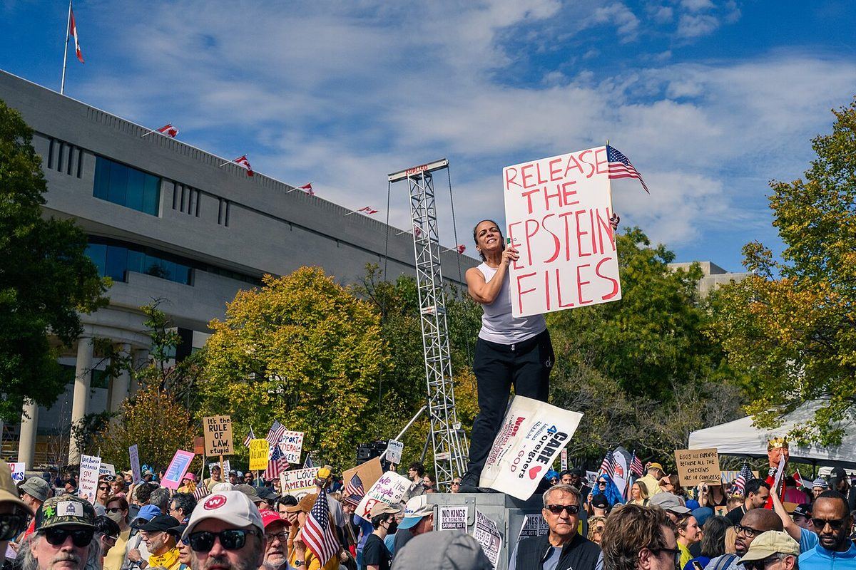 A protester holds a “Release the Epstein Files” sign in Washington, D.C., 18 October 2025.
