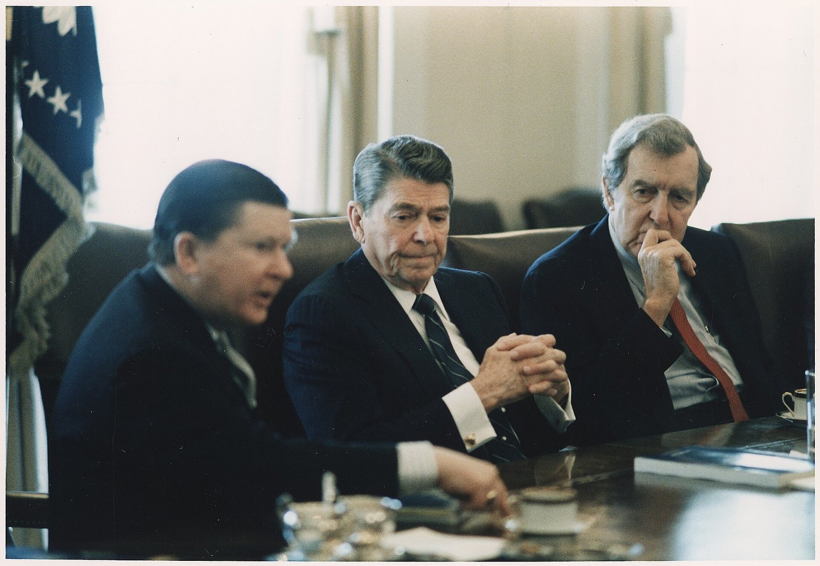 Photograph of President Reagan receiving the Tower Commission Report in the Cabinet Room - NARA - 198581.jpg