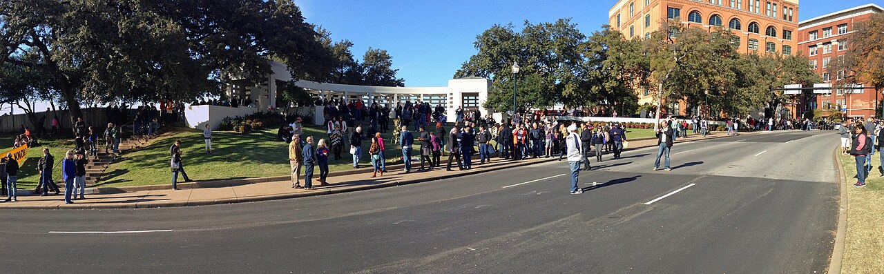 Elm Street and Dealey Plaza in November 2013. Later landscape context; the scene is not presented as unchanged since 1963.