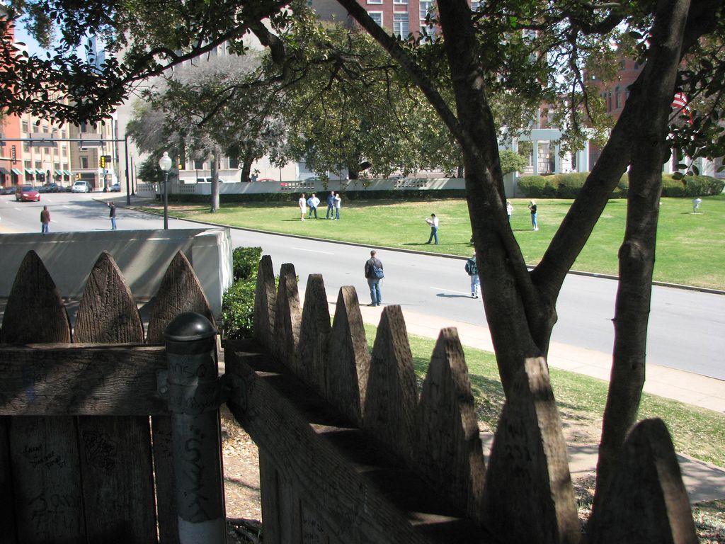 The wooden fence at the top of the grassy knoll.