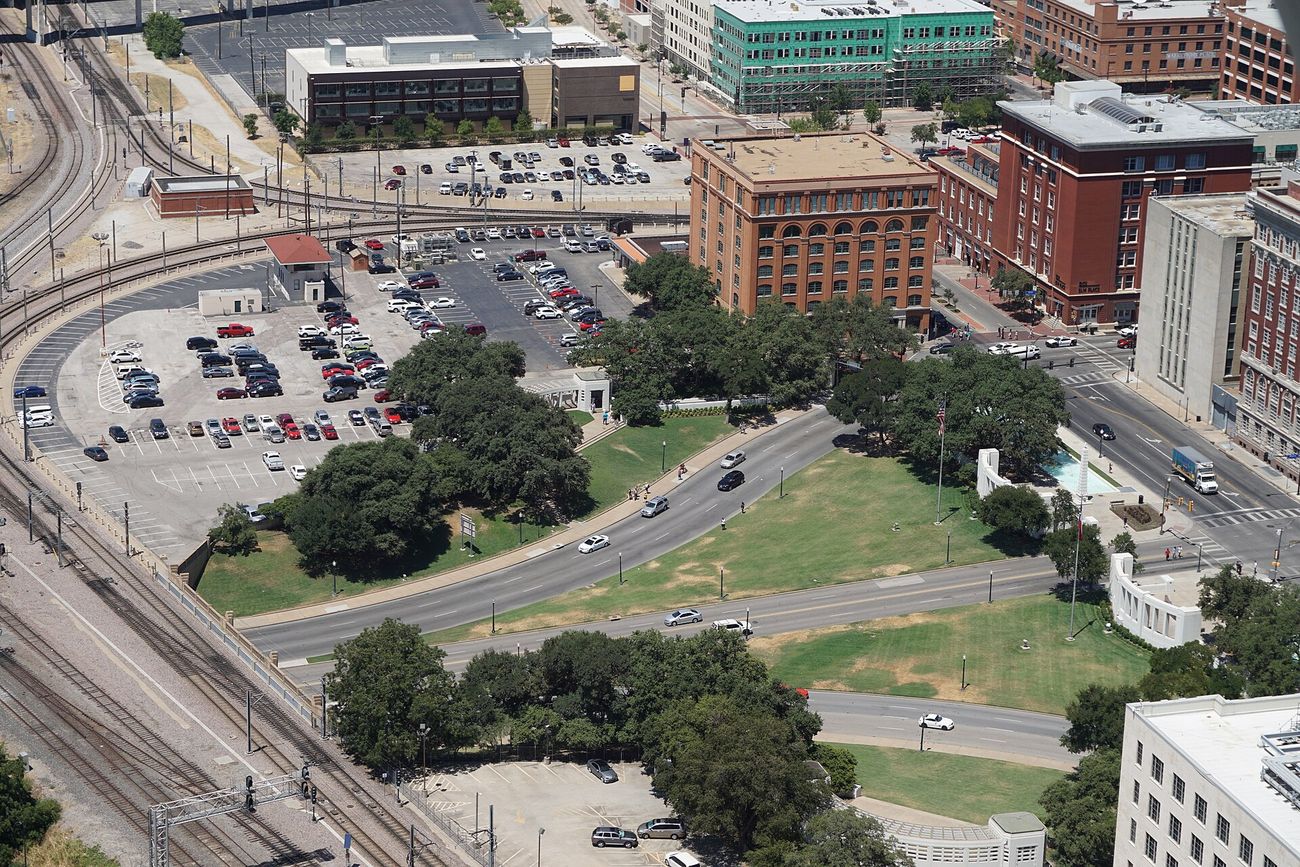 Dealey Plaza from Reunion Tower, 2015: the Depository at left, Elm Street and the knoll at right.