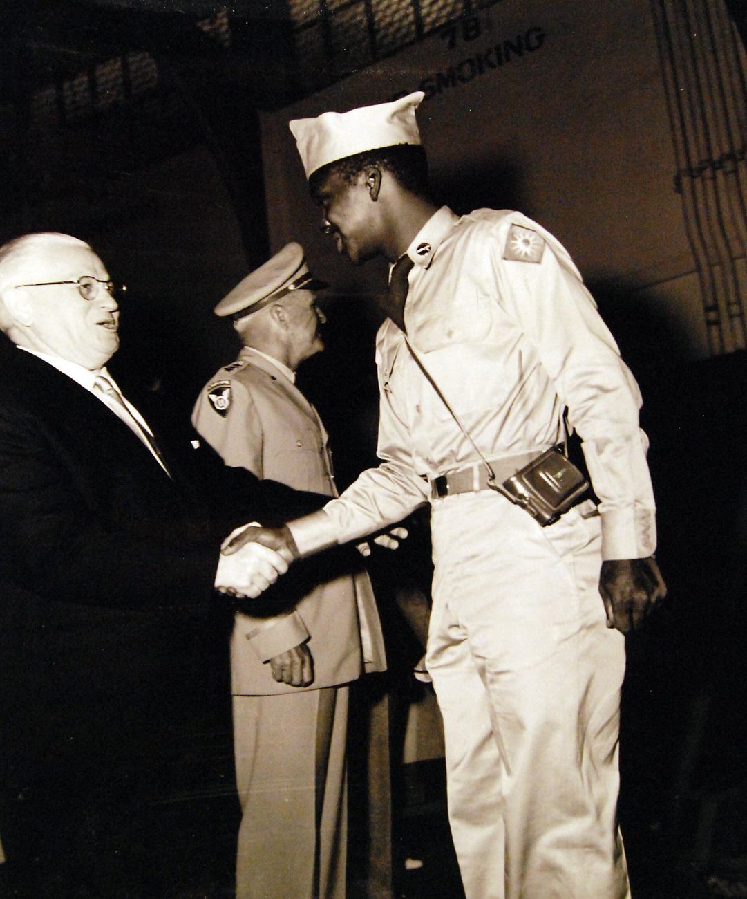 A repatriated Korean War prisoner of war shakes hands with the mayor of San Francisco on arriving home, 1953.