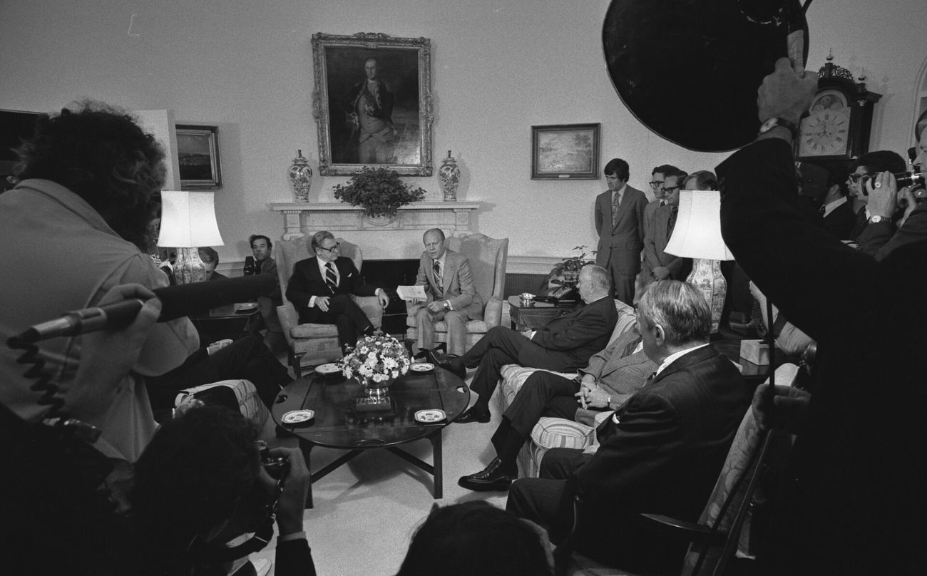 President Ford receives the report of the Rockefeller Commission on CIA activities inside the United States, June 1975.