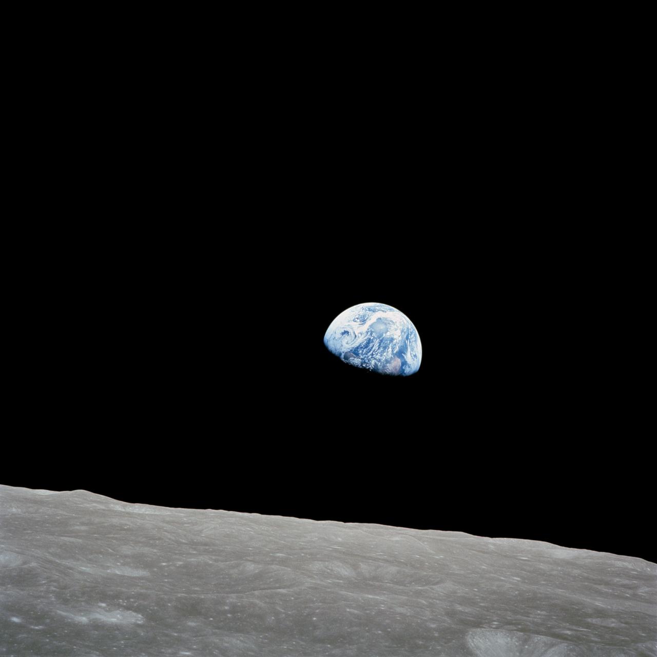Earthrise photographed by the Apollo 8 crew above the lunar horizon in December 1968.