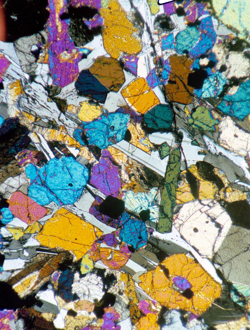Microscopic views of Apollo XII Lunar rock sample thin sections, with and without polarized light.                                     1. Lunar Sample - Apollo XII (Thin Sections)