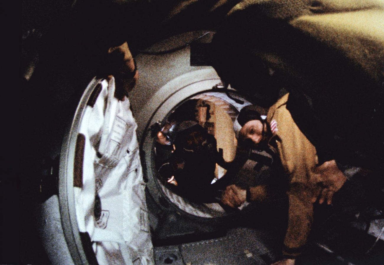 Thomas Stafford and Alexei Leonov shake hands in orbit during the Apollo–Soyuz Test Project, 17 July 1975.