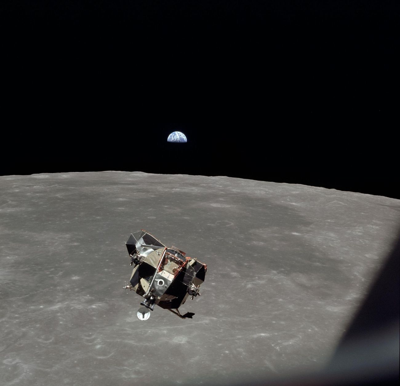 Eagle’s ascent stage rises to meet Columbia, with Earth beyond, 21 July 1969.