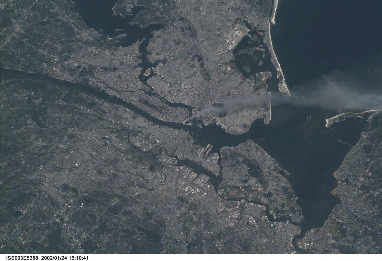 Smoke from lower Manhattan photographed from the International Space Station on September 11, 2001. NASA notes that date identifiers embedded in some related camera frames were incorrect because of a camera problem.
