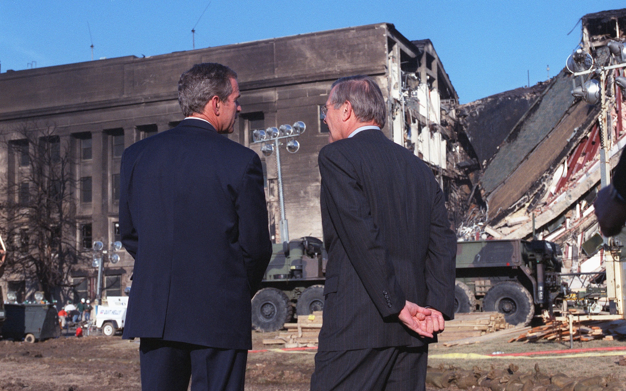 President George W. Bush and Defense Secretary Donald Rumsfeld inspect Pentagon destruction in the days after the attack. Archive date fields disagree; this caption does not assert an exact day.