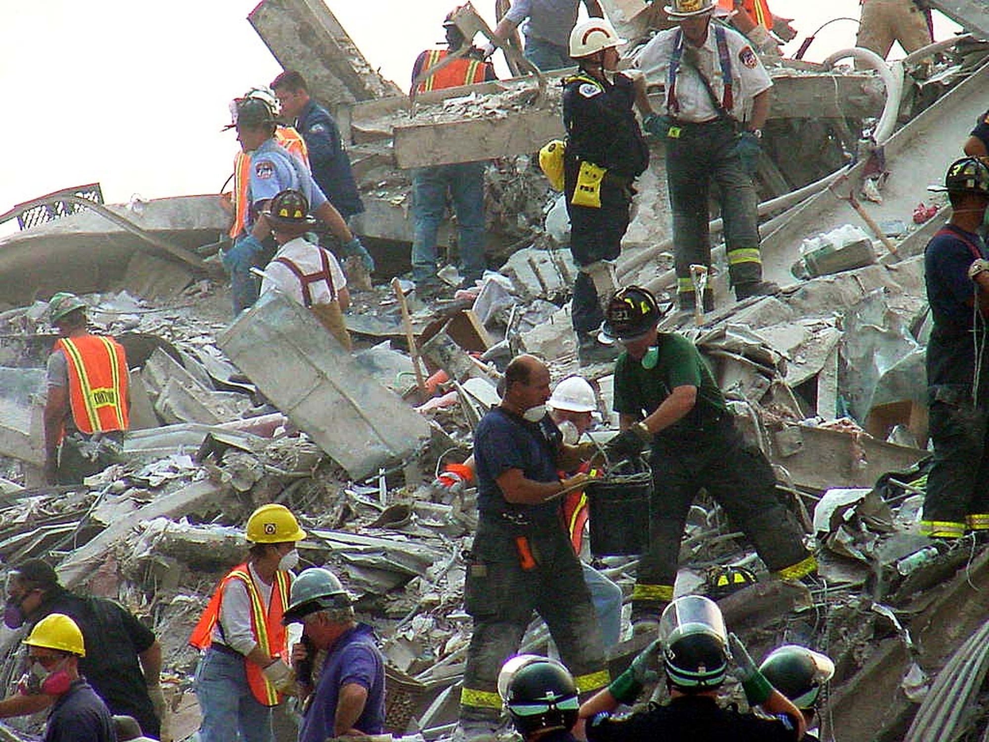 Rescuers search the South Tower rubble after the attacks. The archive posted this historical image later; its displayed 2007 date is not the date of the attack.